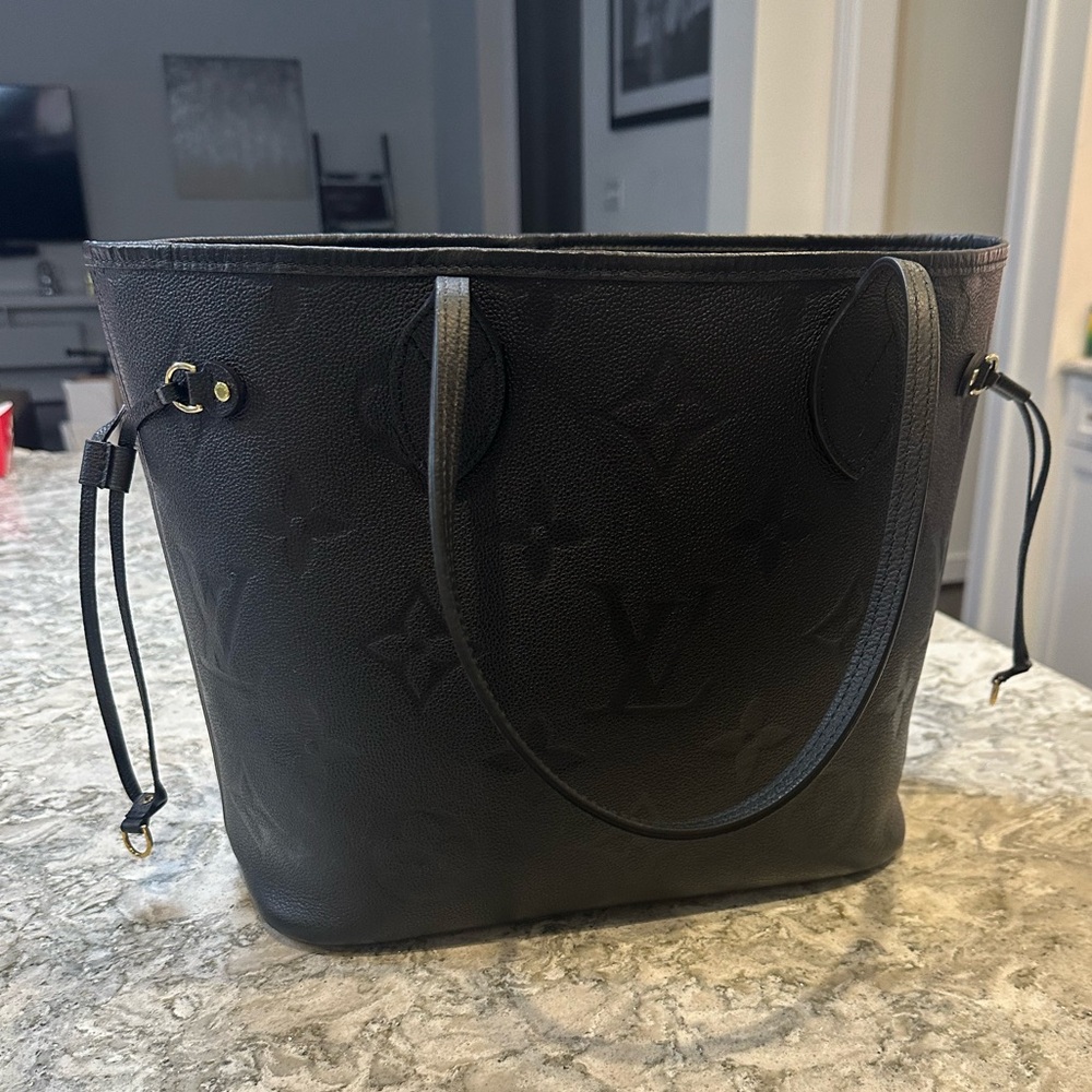 Louis  Vuitton Neverfull Empriente in black.